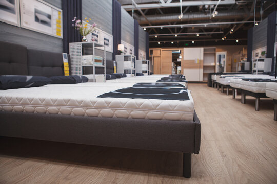 New orthopedic beds on display for sale at furniture supermarket