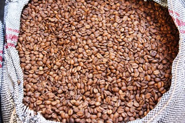 Raw coffee beans in sacks, coffee shop in Athens, Greece.