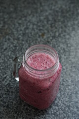 Red berry smoothie in a jar