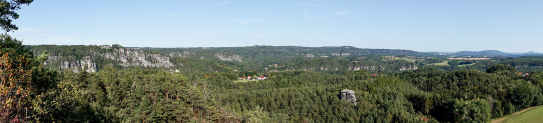 Fototapeta na wymiar Landscape panorama of Saxon Switzerland seen from the Rauenstein mountain. Germany