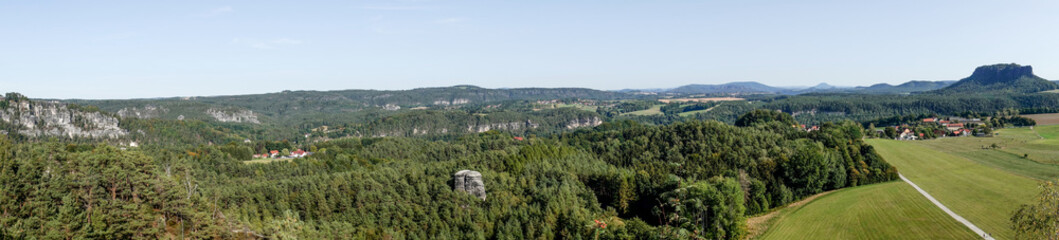 Fototapeta na wymiar Landscape panorama of Saxon Switzerland seen from the Rauenstein mountain. Germany
