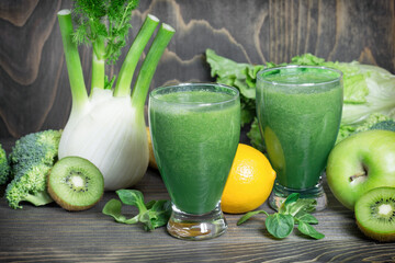 Healthy green smoothie on table close-up