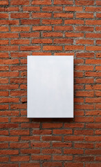 Blank white board on red brick wall