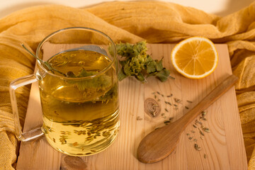 Cup of healthy winter brewed tea with herbs. Tea for immunity, ingredients for the treatment of colds.