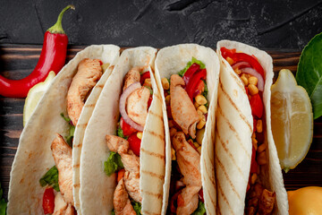  Mexican dish - tacos with chicken and corn, top view