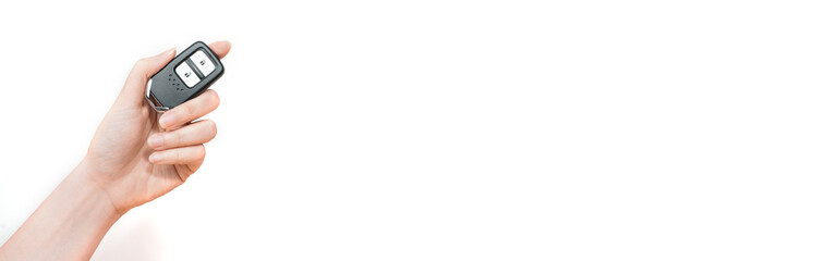 web banner new wireless car key in beauty woman hand with white background