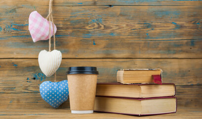 Fototapeta na wymiar Education concept. Online education course. Books and disposable cup on wooden surface