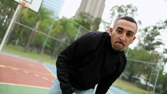 Man dancing street dance. Hispanic guy freestyle urban dance