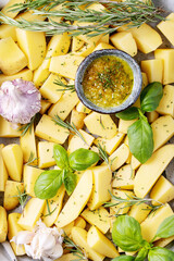 Raw potatoes with fresh rosemary