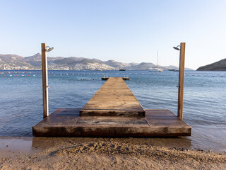 Fototapeta premium Season end in Aegean sea, quiet wooden pier