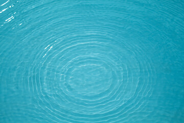 Top view Closeup blue water rings, Circle reflections in pool.