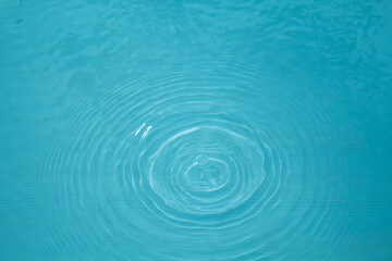 Top view Closeup blue water rings, Circle reflections in pool.