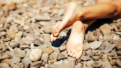 Sensual woman legs. Stone. 