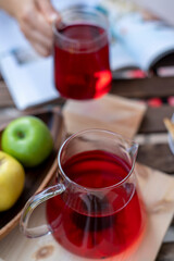 Large variety of multi colored dried tea leaves and flowers shot on white table