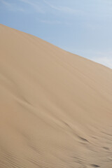Fototapeta na wymiar Beautiful beach landscape. Blue sky. Dune. White sand. Horizon. Sunny day. Empty nature. 