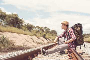 Asian man with backpack traveling in summer time
