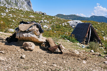 saddler's temporary workshop in the mountains while grazing livestock in highlang pastures in the...