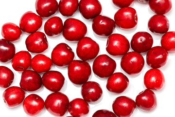 fresh black cherries on a white background