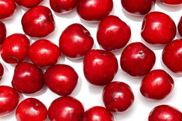 fresh black cherries on a white background