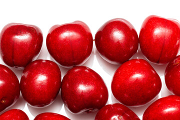 fresh black cherries on white background