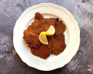 Classic dish. Crispy deep fried chicken livers with lemon. 