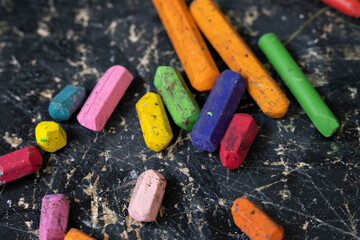 Wax crayons on black background