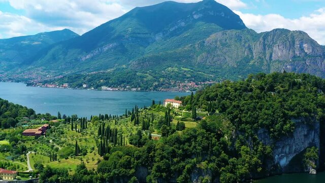 Aerial view with a drone of lake Como in Italy under the blue sky. Beautiful landscape view of the lake and his mountains in the background 4K