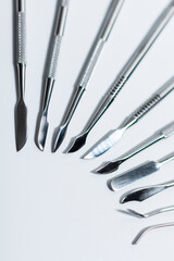 A set of manicure tools. Shovels and hatchets. There is a place for advertising in the lower left...