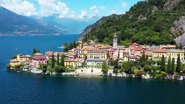Village by the Lake Como in Italy. Aerial view with a drone of the beautiful small village under the blue sky 4K