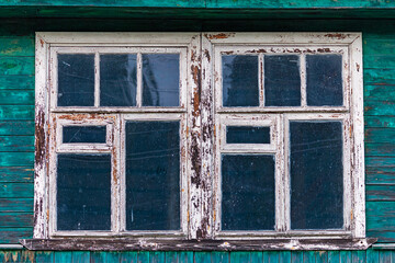 windows of old shabby wooden house