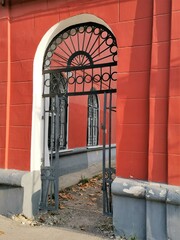 Old red arch in autumn city