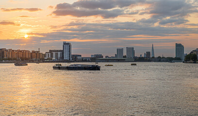 Obraz premium The City of London across the River Thames at sunset in England