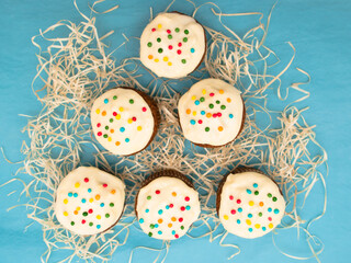 Carrot muffins with cream cheese frosting and sprinkles