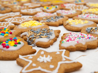 Christmas gingerbread cookies with icing and colorful sprinkles