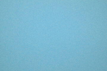 A dense industrial sheet of paper with a textured surface