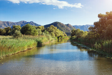 Lake and mountains in an ecological reserve - nature park with fishing