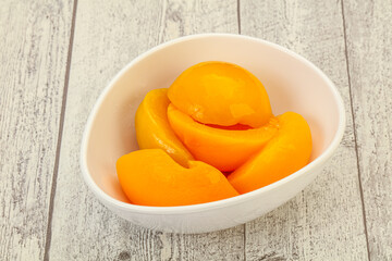 Marinated peaches fruit in the bowl