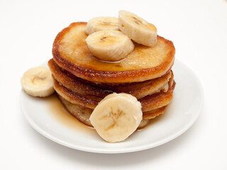 Fototapeta na wymiar Banana pancakes with maple syrup