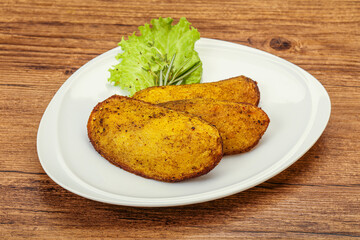 Baked potato with herbs and spices
