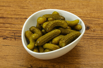 Pickled gherkin in the bowl