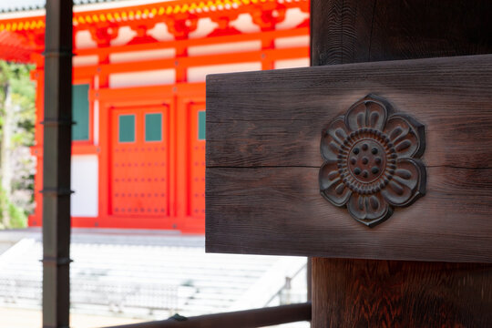 Red Japanese Pagoda roof and boss detail with cherry blossoms