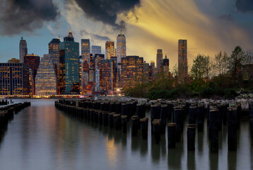 Fototapeta na wymiar New York City with Manhattan downtown skyline over East River during sunset