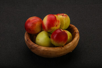 Sweet small nectarines in the basket