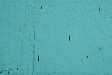 Green surface with dark spots of paint. Green background for design