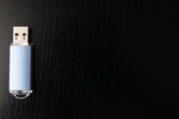 Flash drive on a black wooden table