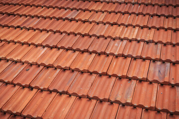 Old red tile in-line roof pattern on the house and buildings