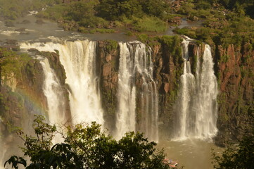Naklejka premium The powerful and mighty Iguazu (Iguacu) Waterfalls between Brazil and Argentina