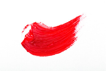 Red colored brush stroke paiting over isolated background, canvas watercolor texture, red lipstick smudge