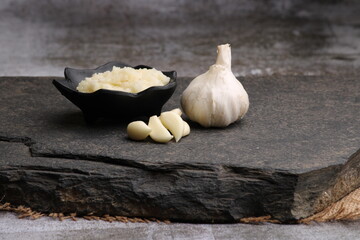 Garlic Paste or Toum or Toumya with raw garlic, isolated over black background