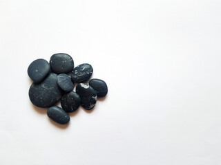 The background of black pebbles. Black sea pebbles